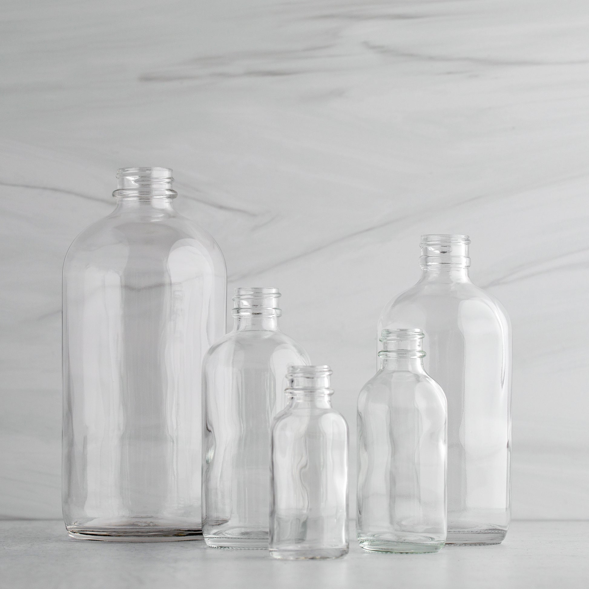 2 oz Clear Glass Boston Round Bottle 20-400 Neck Finish